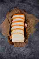 Free photo bread slices on a burlap .