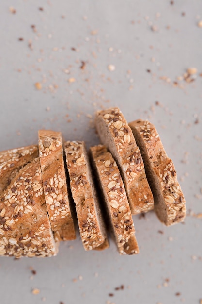 Bread slices on white background top view