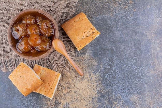 Bread slices with fig confiture in a cup