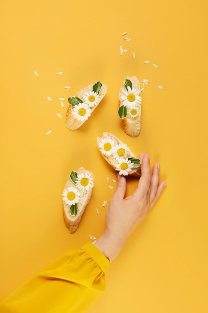 Bread slices with flowers top view