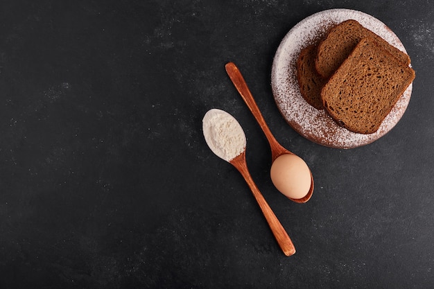 Bread slices with ingredients, top view. 