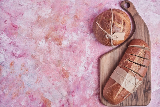 Bread varieties on a wooden board.