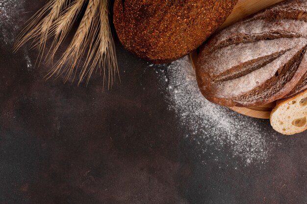 Bread with flour on textured background