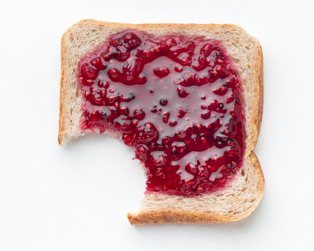Bread with jam on white background