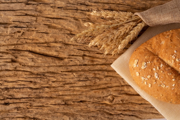 Bread on a wooden table on an old wooden floor.