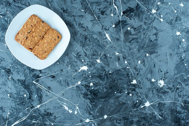 Breadcrumbs on a plate , on the marble table. 