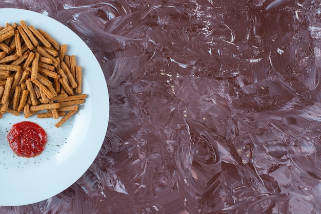 Breadcrumbs with sauces on a plate , on the marble table. 