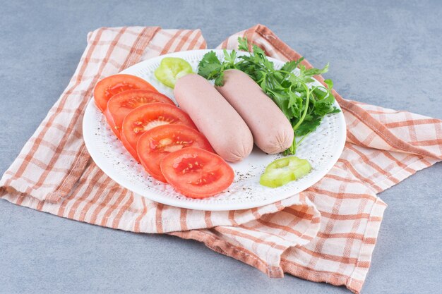 Breakfast. Boiled sausage and vegetables. 