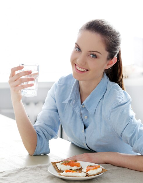 Breakfast. Cute girl at the table