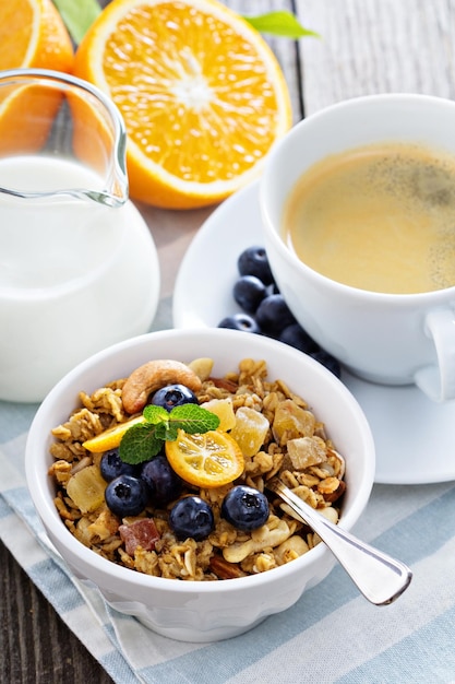 Breakfast set on the table with granola