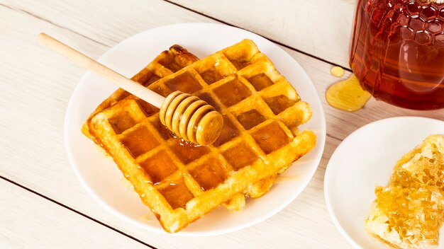 Breakfast with belgian waffles and honey