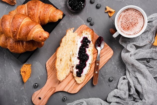 Breakfast with croissants, jam and coffee