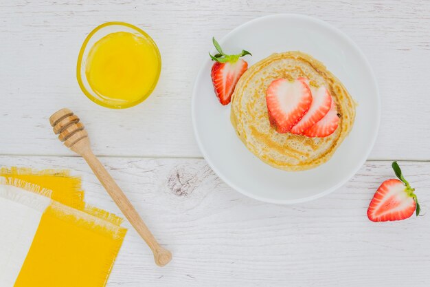 Breakfast with pancakes and strawberries