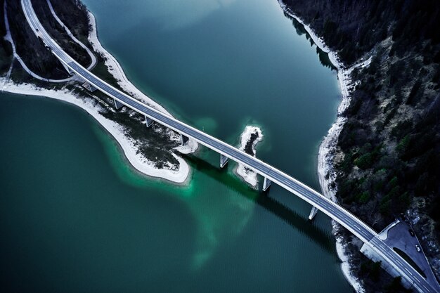 Breathtaking high angle shot of a highway above the turquoise water