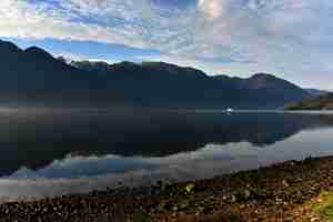 Free photo breathtaking view of a blue sky a lake and mountains