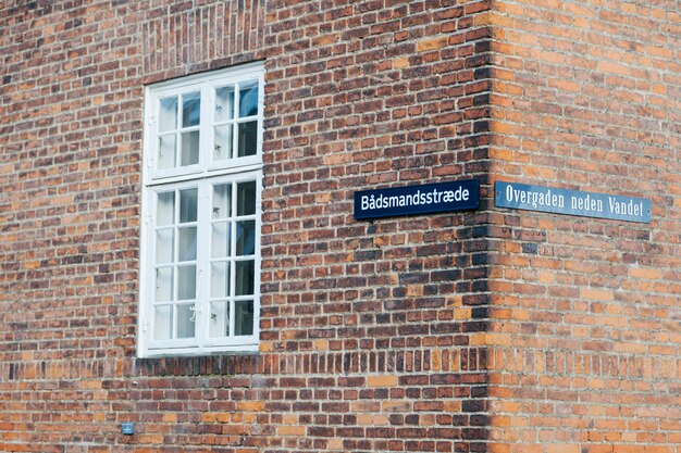 Brick building with tablets on corner