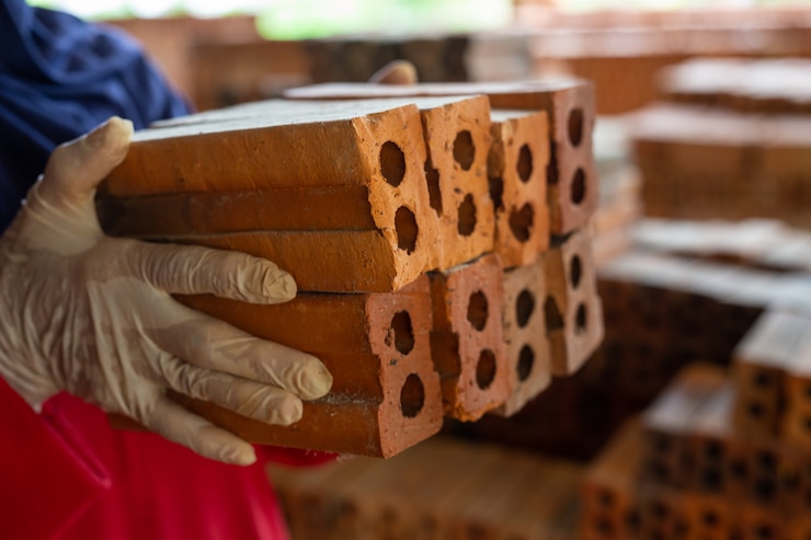 Free Photo brick piles placed on the factory floor.
