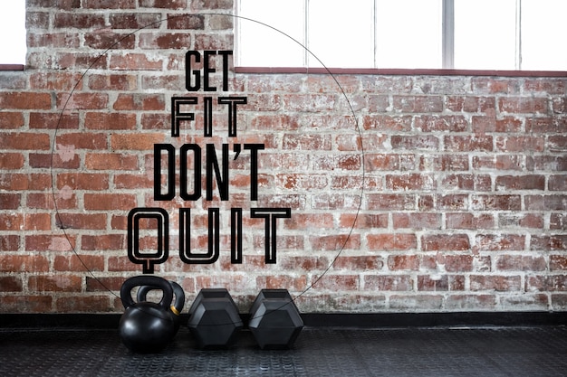 Free photo brick wall and dumbbells