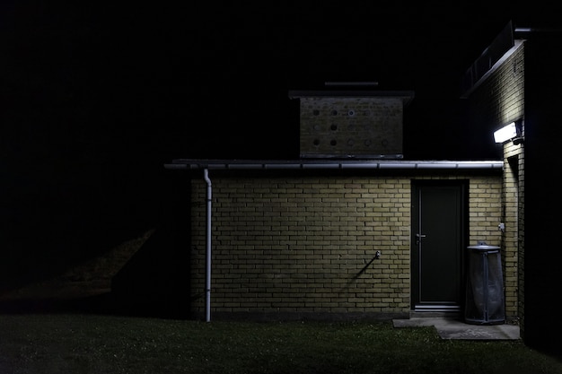 A brick wall storage room at night