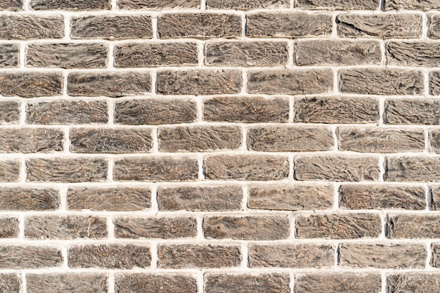 Free photo brick wall. texture of gray creme brick with white filling