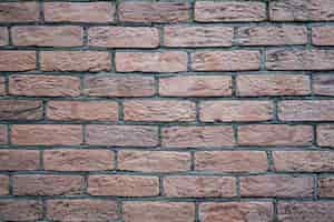 Free photo brick wall. texture of red brick with gray filling