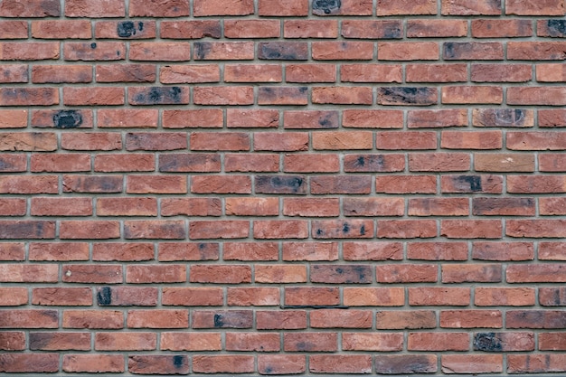 Free photo brick wall. texture of red brick with gray filling