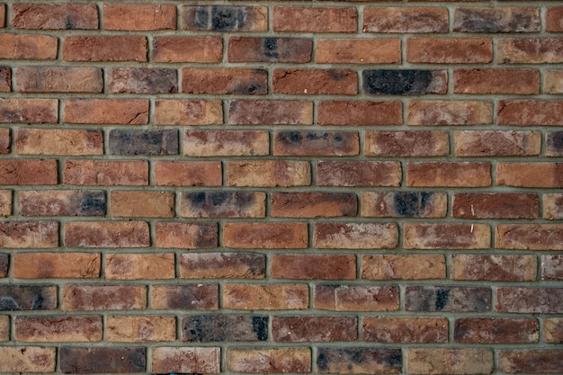 Free photo brick wall. texture of red brick with gray filling