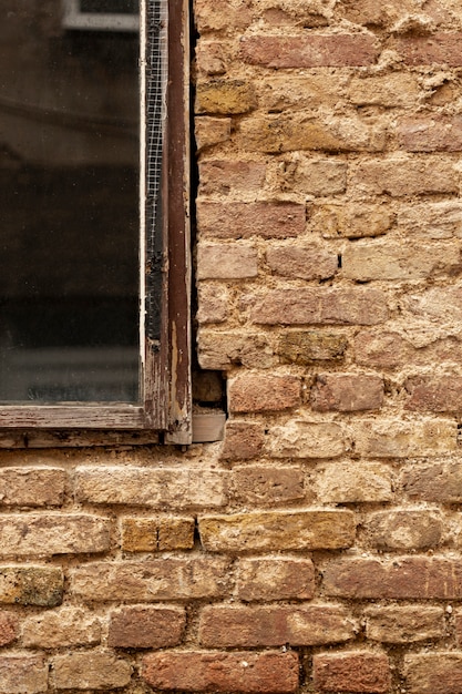 Brick wall with aged window