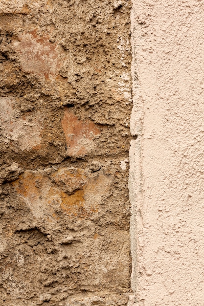 Bricks and concrete wall with rough surface