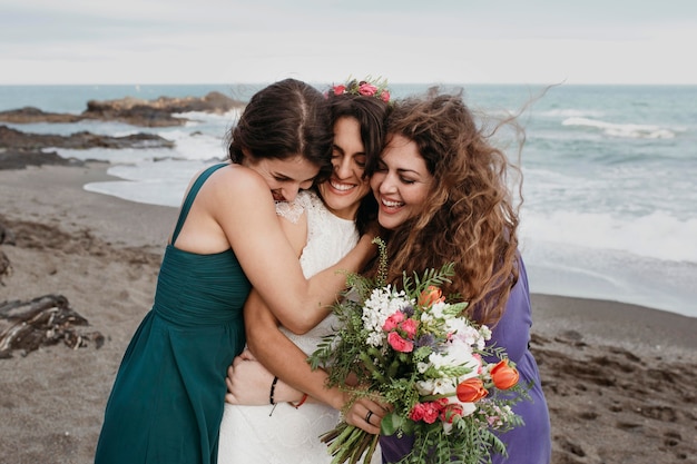 Bride and bridemaids on the beach