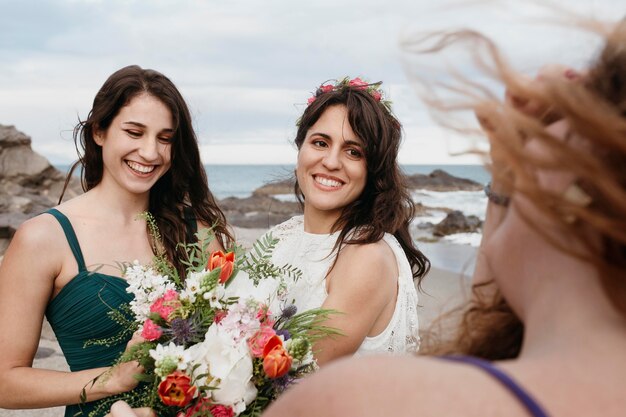 Bride and bridemaids on the beach