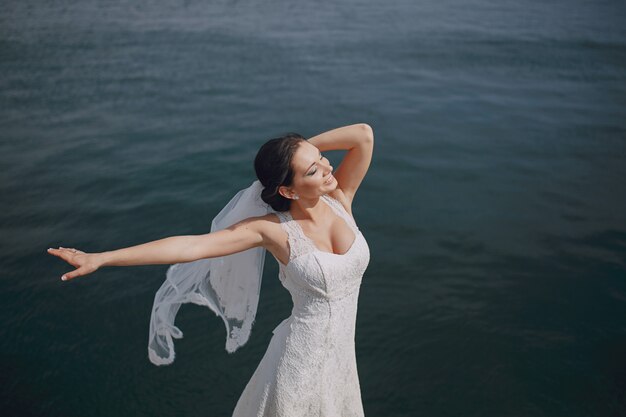 Bride dancing in the sea