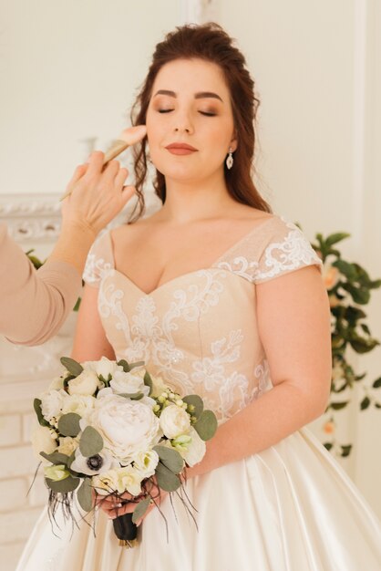 Bride getting  her make up ready