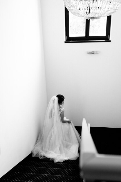 Bride goes down the hotel stairs