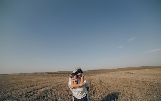 Free photo bride in the groom back