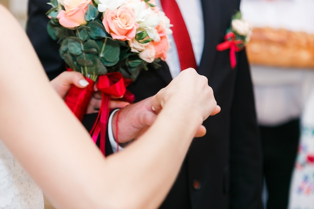 the bride and groom hands