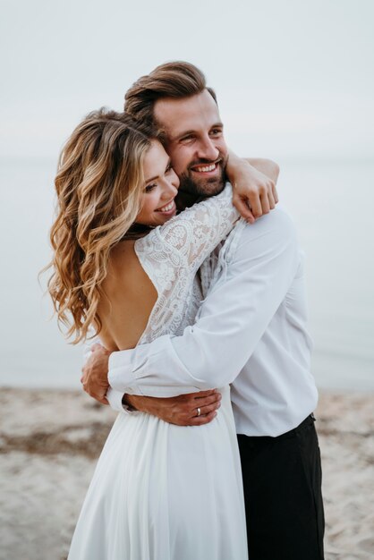 Bride and groom having a beach wedding