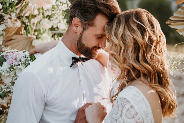 Bride and groom having their wedding at the beach