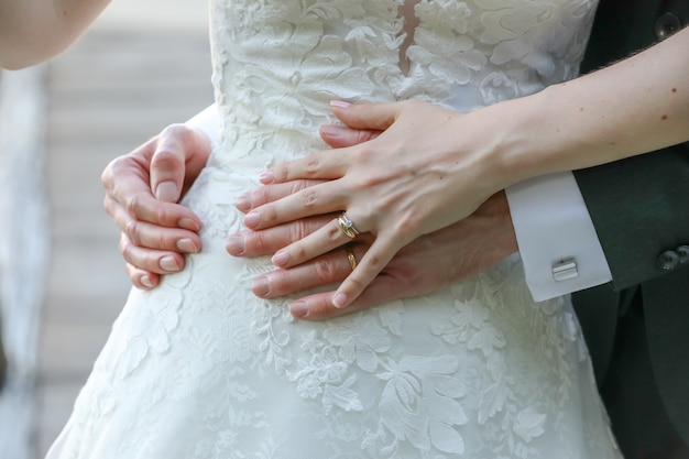 Free photo bride and a groom hugging each other