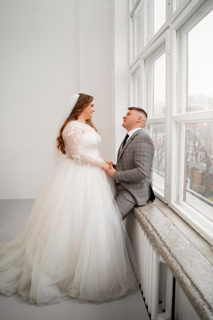 Bride and groom posing happily together after wedding ceremony