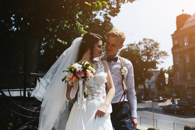 Bride and groom posing on the streets of the old town