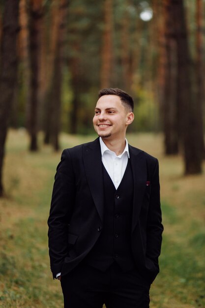 The bride and groom run through a forest Wedding photo shoot