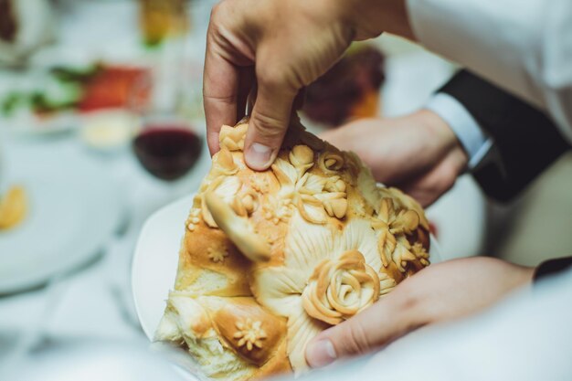 Bride and groom salt broken piece of wedding loaf