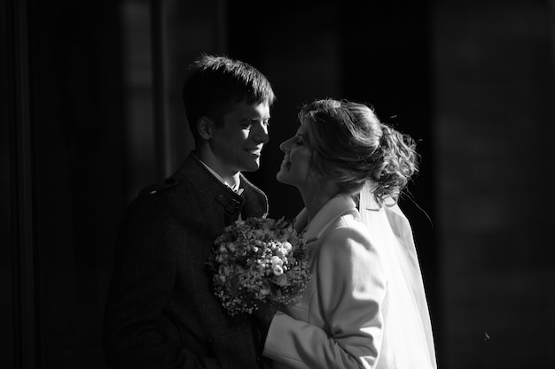 Bride and groom tenderly looking at each other