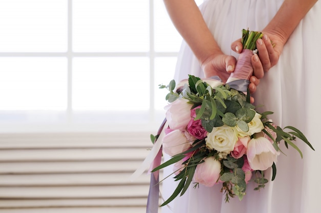 Bride holding floral bouquet