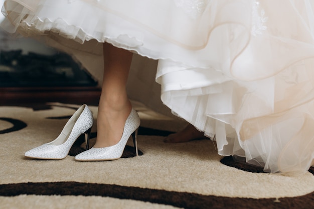 Bride is wearing her bridal heels