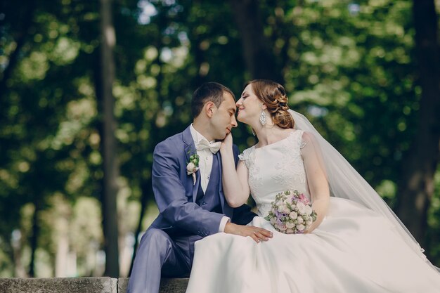 Bride kissing the groom's forehead