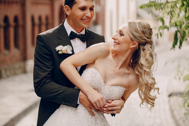 Bride laughing with her husband