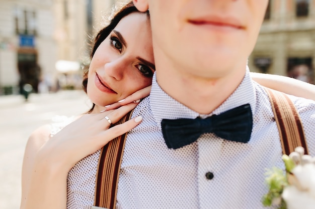 Bride leaning on her husband's shoulder