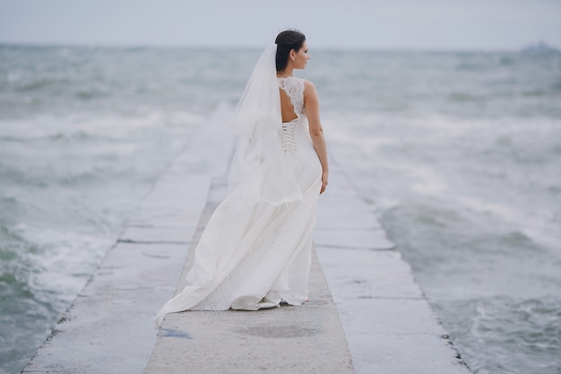 Bride looking at the sea